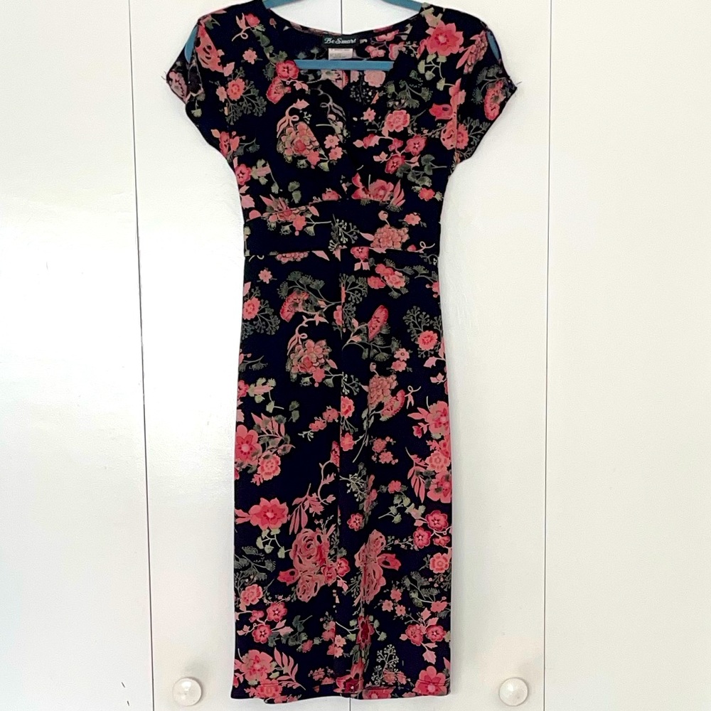 Floral knee length Dress with flutter sleeves and ties in the back.